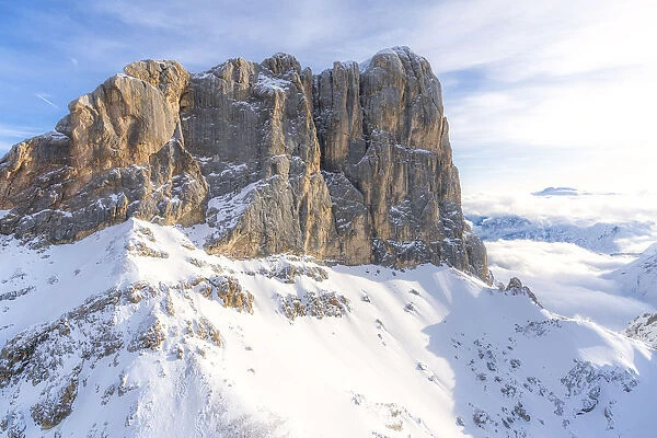 Aerial view of west ridge and south face of Punta Penia in winter, Dolomites
