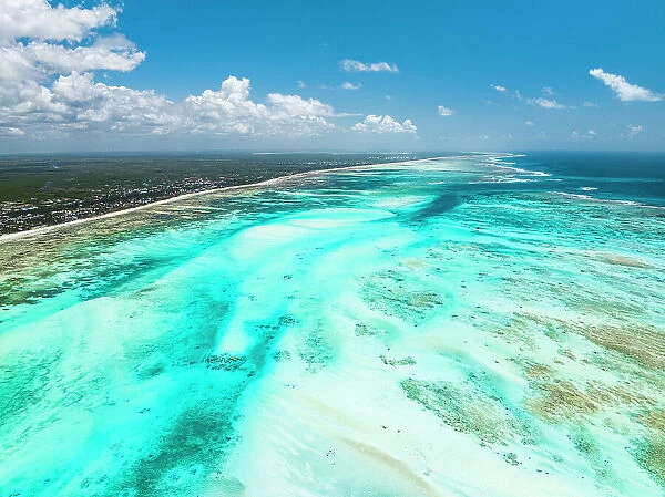 Aerial view of white coral sand of a blue lagoon at low tide, Paje, Jambiani, Zanzibar, Tanzania, East Africa, Africa