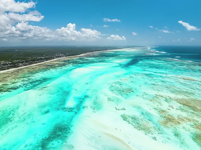 Framed Print : Aerial view of white coral sand of a blue lagoon at low tide, Paje, Jambiani, Zanzibar, Tanzania, East Africa, Africa Framed Print : Aerial view of white coral sand of a blue lagoon at low tide, Paje, Jambiani, Zanzibar, Tanzania, East Africa, Africa