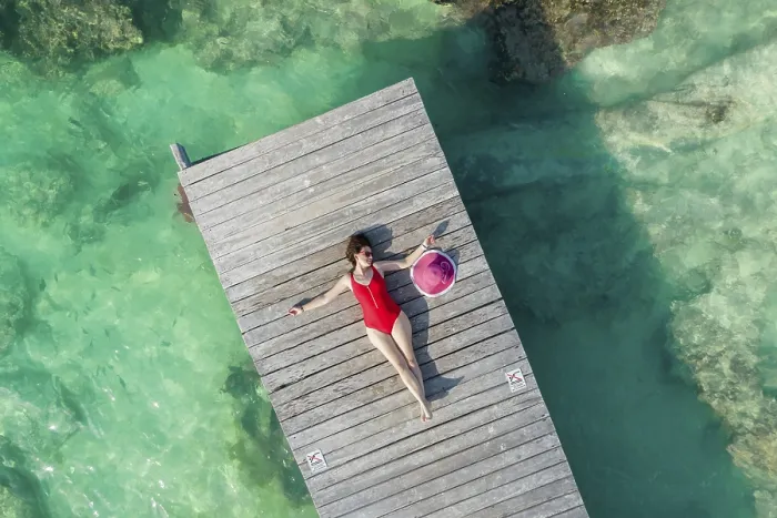 Framed Print : Aerial view of woman laying on wooden pier at sunny summer day in Cancun, Mexico, top view. Young sexy woman in red swimsuit in summertime in Caribbean Framed Print : Aerial view of woman laying on wooden pier at sunny summer day in Cancun, Mexico, top view. Young sexy woman in red swimsuit in summertime in Caribbean