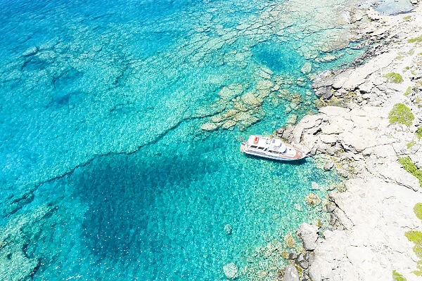 Aerial view of yacht moored in the crystal clear sea, Crete island, Greek Islands, Greece, Europe