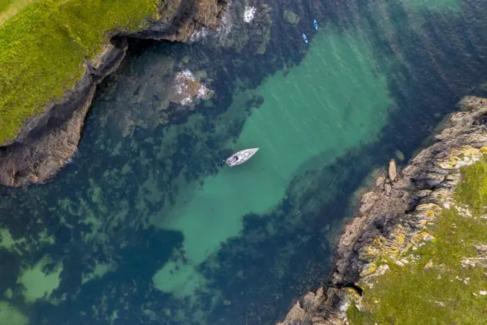 Framed Print : Aerial view of a yacht moored in Port Quin, Cornwall, England, United Kingdom, Europe Framed Print : Aerial view of a yacht moored in Port Quin, Cornwall, England, United Kingdom, Europe