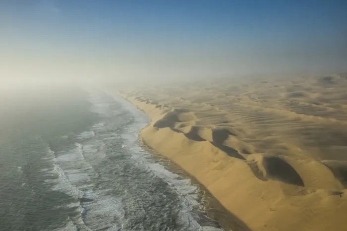 Framed Print : Aerials of sand dunes of the Namib Desert meeting the Atlantic Ocean, Namibia, Africa Framed Print : Aerials of sand dunes of the Namib Desert meeting the Atlantic Ocean, Namibia, Africa