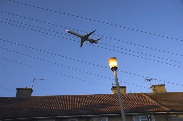 Aeroplane above houses, Hounslow, Greater London, England, United Kingdom, Europe