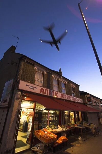Aeroplane above shop, Hounslow, Greater London, England, United Kingdom, Europe