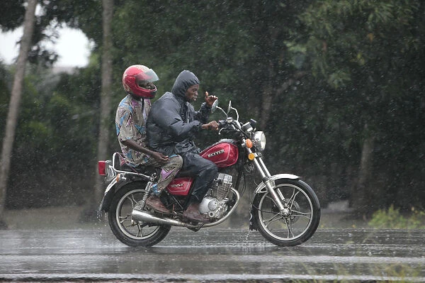 African road in the rain, Ouidah, Benin, West Africa, Africa
