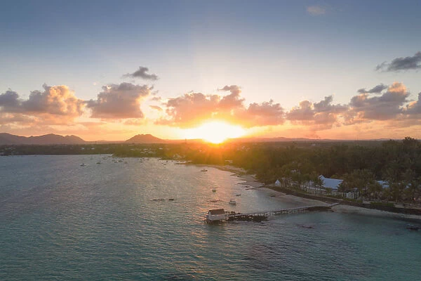 African sunset over tropical lagoon and pier, aerial view, Trou d Eau Douce, Flacq