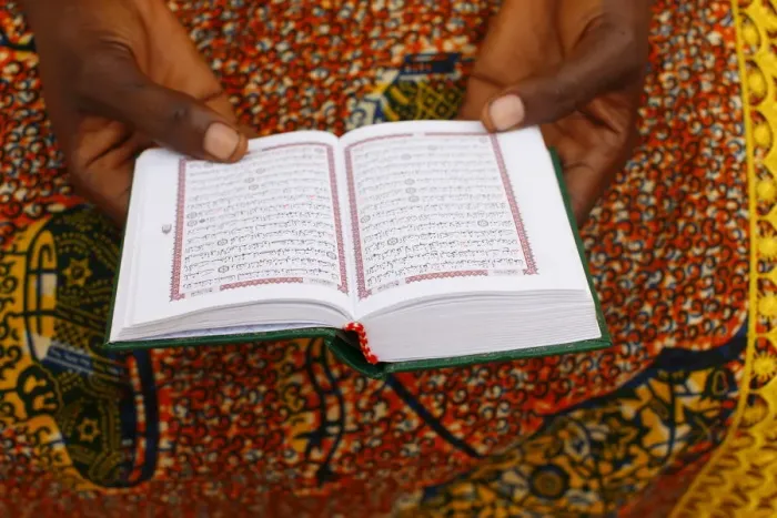 Framed Print : African woman reading the Koran, Lome, Togo, West Africa, Africa Framed Print : African woman reading the Koran, Lome, Togo, West Africa, Africa