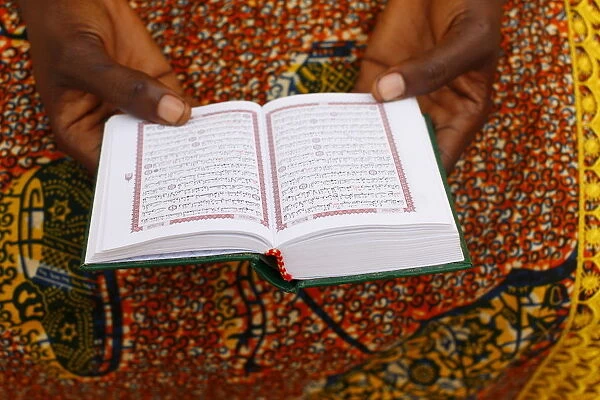 African woman reading the Koran, Lome, Togo, West Africa, Africa