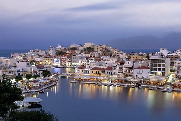 Agios Nikolaos old town with lake in its centre at dusk, Lasithi prefecture, Crete