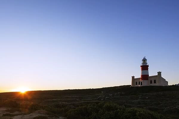 Agulhas lighthouse at southernmost tip of Africa at sunset, Agulhas National Park