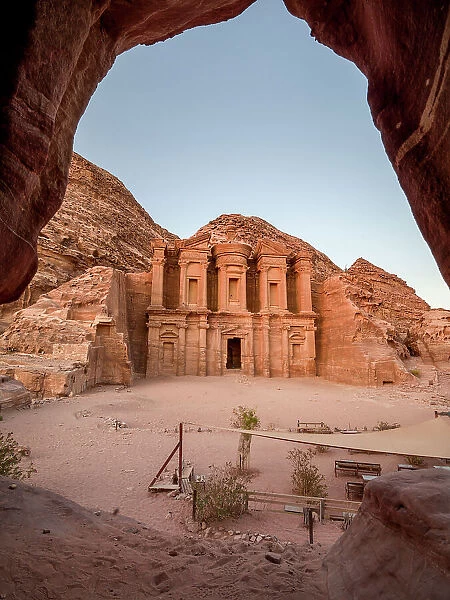 Al Deir (Monastery) monument at sunset, carved into the mountain side and framed by a cave, Petra, UNESCO World Heritage Site, Jordan, Middle East