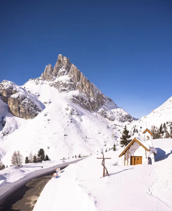 Framed Print : Alpine chapel in the snowy landscape with Sass de Stria peak in the background