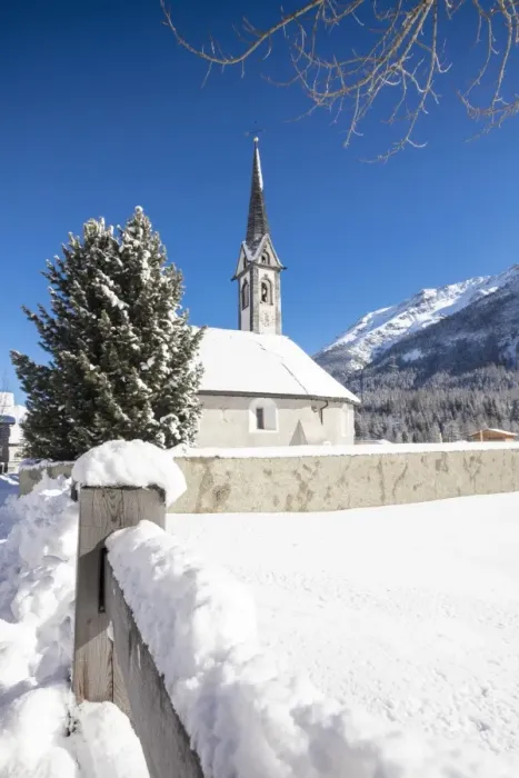 Framed Print : Alpine church covered with snow framed by blue sky, Cinuos, Canton of Graubunden Framed Print : Alpine church covered with snow framed by blue sky, Cinuos, Canton of Graubunden