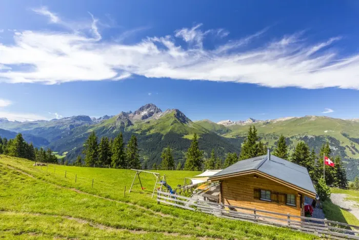 Framed Print : Alpine hut with Swiss flag beneath stunning clouds, Urses, Surselva, Graubunden Framed Print : Alpine hut with Swiss flag beneath stunning clouds, Urses, Surselva, Graubunden