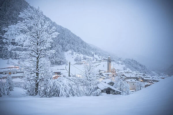 Alpine village in a white winter landscape after snowfall, Gerola Alta, Valgerola