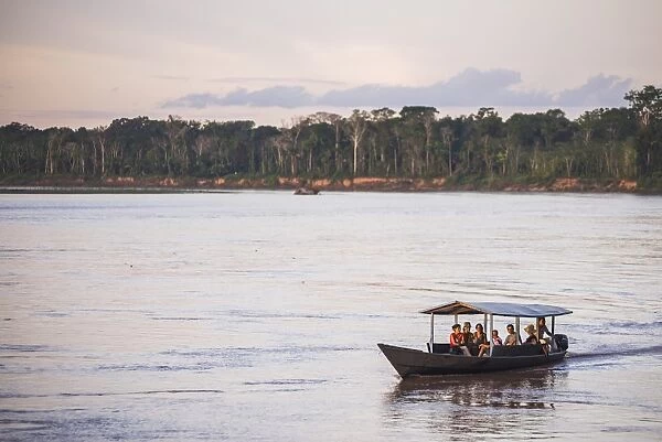 Amazon Jungle boat trip at sunset, Tambopata National Reserve, Peru, South America