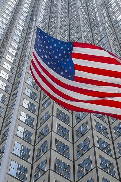 American flag set against skyscraper building windows in Downtown Miami, Miami, Florida