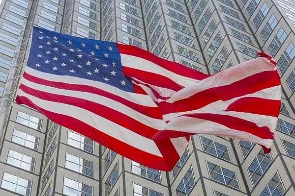 American flag set against skyscraper building windows in Downtown Miami, Miami, Florida