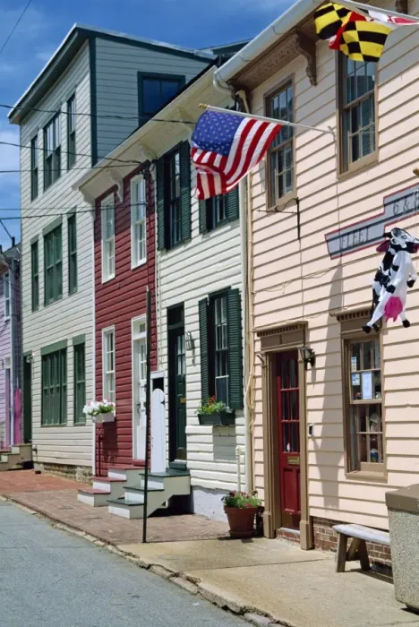 Framed Print : American flag on wooden buildings on a street in Annapolis Framed Print : American flag on wooden buildings on a street in Annapolis