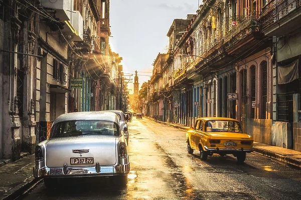 American and Russian vintage cars at sunset, La Habana (Havana), Cuba, West Indies