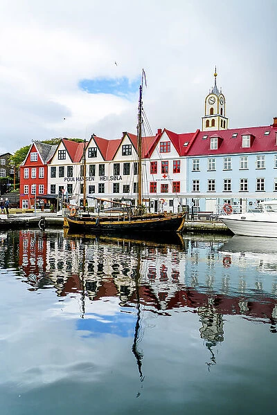 Ancient buildings and ship moored in the harbor of Torshavn, Streymoy Island, Faroe Islands, Denmark, Europe