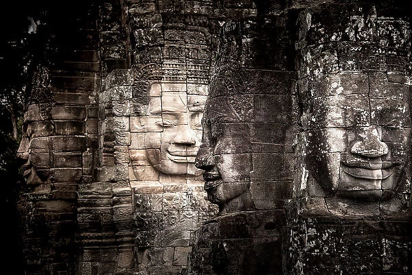 Ancient faces carved in stone at Bayon temple, Angkor Wat, UNESCO World Heritage Site, Cambodia, Indochina, Southeast Asia, Asia