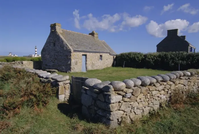 Framed Print : Ancient house with Creac h lighthouse behind on Ouessant Island, Brittany Framed Print : Ancient house with Creac h lighthouse behind on Ouessant Island, Brittany