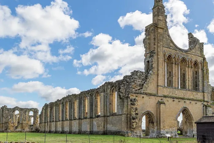 Framed Print : Ancient ruins of a Gothic abbey with arches under a blue sky with clouds at Byland Abbey, North Yorkshire, England, United Kingdom, Europe Framed Print : Ancient ruins of a Gothic abbey with arches under a blue sky with clouds at Byland Abbey, North Yorkshire, England, United Kingdom, Europe