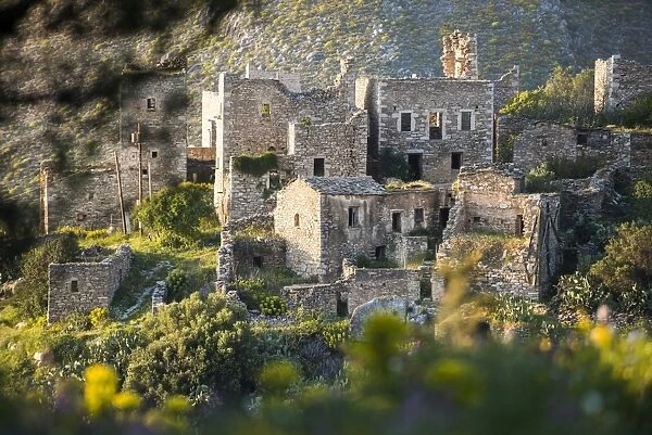 The ancient towers of Vathia among wild spring flowers on the Mani Peninsula in the Peloponnese