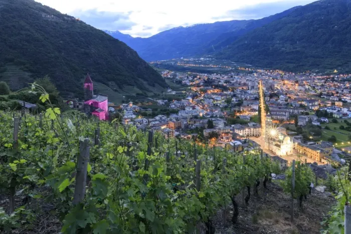 Framed Print : Ancient Xenodochio of Santa Perpetua and the illuminated town of Tirano, province of Sondrio Framed Print : Ancient Xenodochio of Santa Perpetua and the illuminated town of Tirano, province of Sondrio