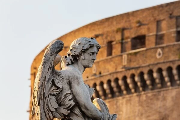 Angel statue on Ponte Sant Angelo with Castel Sant Angelo, Rome, Lazio, Italy, Europe