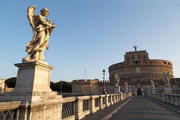 Angel statues on Ponte Sant Angelo bridge with Castel Sant Angelo, Rome, Lazio, Italy, Europe