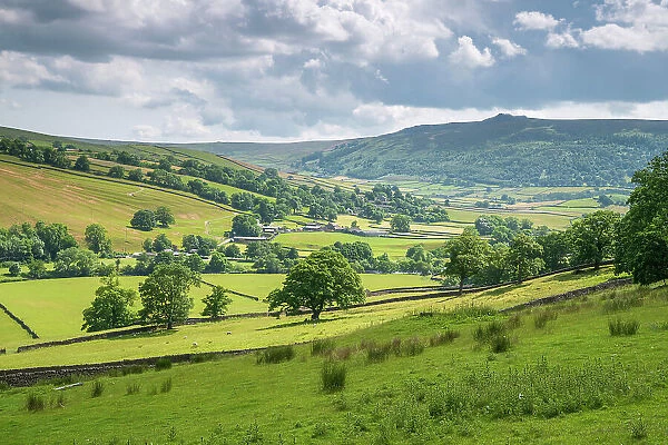 Appletreewick village and the River Wharfe with distant Simon's Seat in Wharfedale, The Yorkshire Dales, Yorkshire, England, United Kingdom, Europe