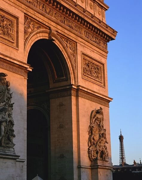 The Arc de Triomphe at dusk, with the Eiffel Tower behind, Paris, France, Europe