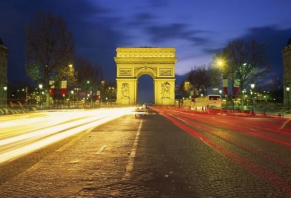 Arc de Triomphe illuminated at dusk, Paris, France, Europe