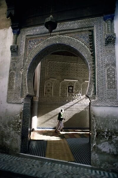 Arched entrance to Islamic mosque in the medina