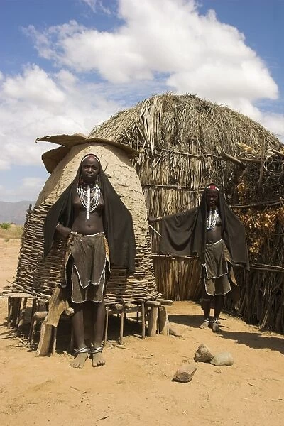 Ari women standing outside house, Lower Omo Valley, Ethiopia, Africa
