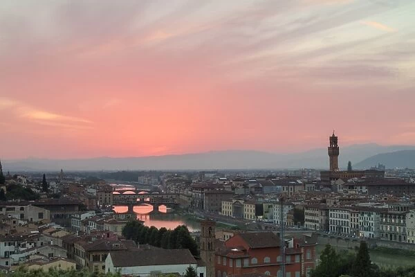 Arno River with Ponte Vecchio and Palazzo Vecchio at sunset seen from Piazzale Michelangelo