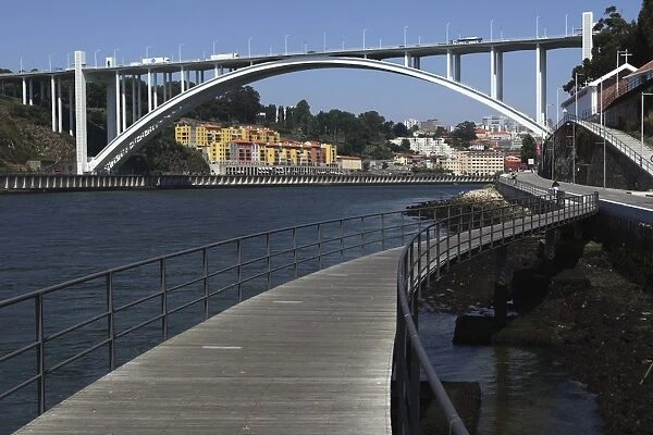 The Arrabida Bridge, designed by Edgar Cardoso, spans the River Douro between Vila Nova de Gaia