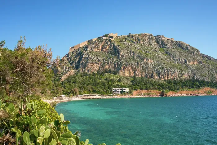 Framed Print : Arvanitias beach in historic city of Nafplion with Palamidi fortress on top of the mountain, Nafplion, Peloponnese, Greece Framed Print : Arvanitias beach in historic city of Nafplion with Palamidi fortress on top of the mountain, Nafplion, Peloponnese, Greece