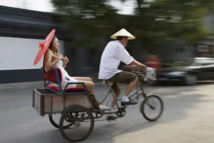 Framed Print : Asian woman (Chinese-Thai) riding in cycle rickshaw, Hutong District, Beijing Framed Print : Asian woman (Chinese-Thai) riding in cycle rickshaw, Hutong District, Beijing