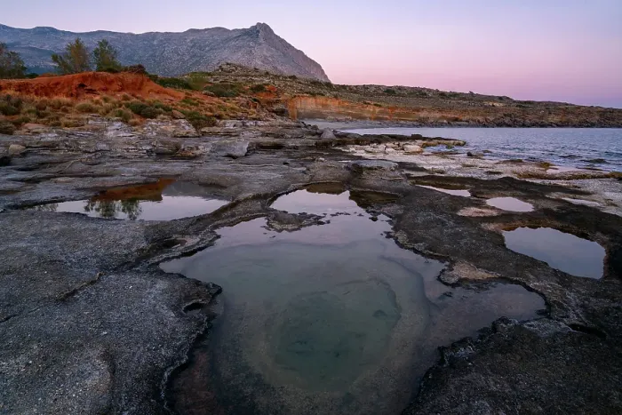Framed Print : Aspes beach, natural holes in the rocks full of water at sunset, with sea in the background, Greece Framed Print : Aspes beach, natural holes in the rocks full of water at sunset, with sea in the background, Greece