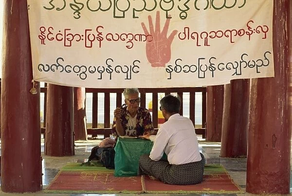 Astrologer giving a reading at the Shwe Zigon Pagoda, Bagan (Pagan) area