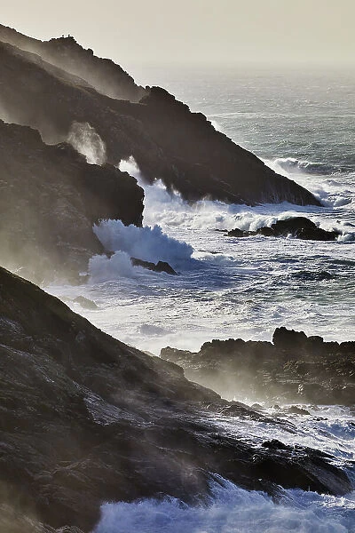 Atlantic cliffs pounded by surf and spray during stormy winter weather, at Pendeen, near S. t Just, in the far west of Cornwall, England, United Kingdom, Europe