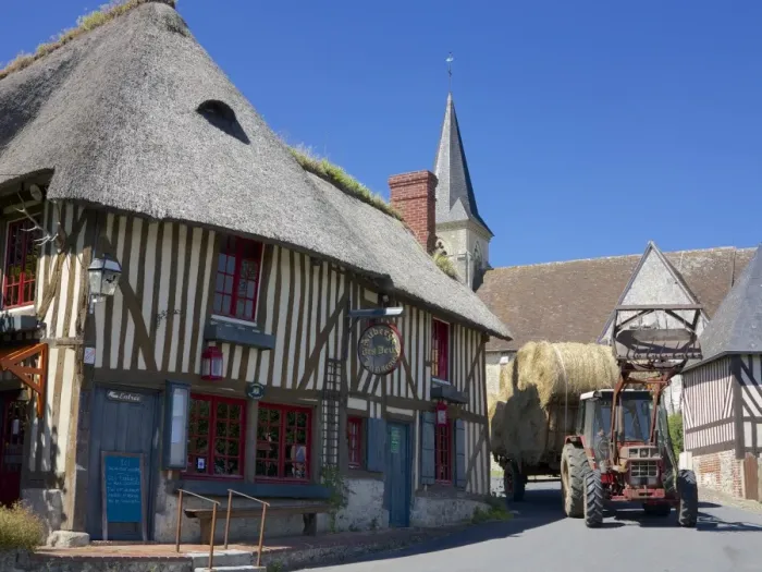 Framed Print : Auberge des Deux Tonneaux (Two Barrels Inn), typical ancient Norman cottage, thatched and half timbered, with tractor, Pierrefitte en Auge, Calvados, Normandy, France, Europe