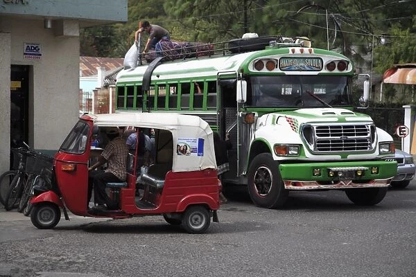 Auto rickshaw and public bus, Panajachel, Lake Atitlan, Guatemala, Central America
