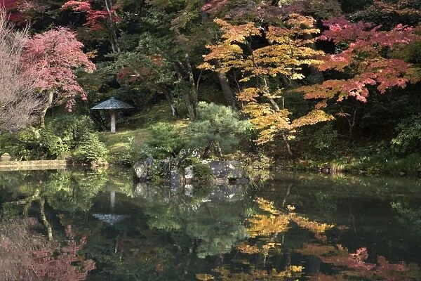 Autumn colours reflected in Hisagoike pond, Kenrokuen Garden, Kanazawa, Ishikawa Prefecture