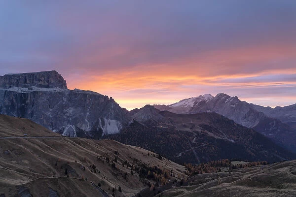 Autumn sunrise over Marmolada and Sass Pordoi from Passo Sella, Val Gardena, Dolomites