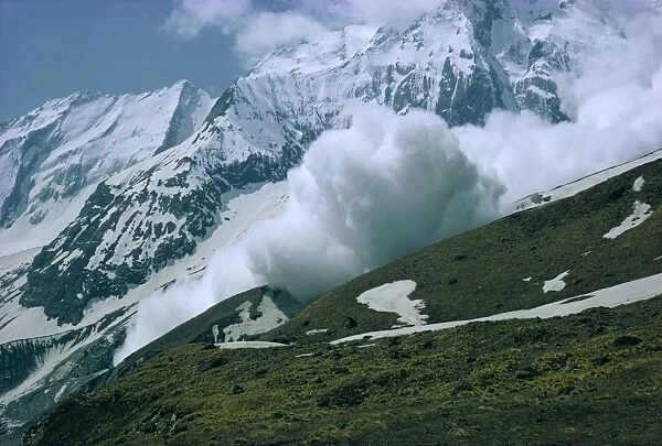 An avalanche on Hiunchuli in the Himalayas in Nepal